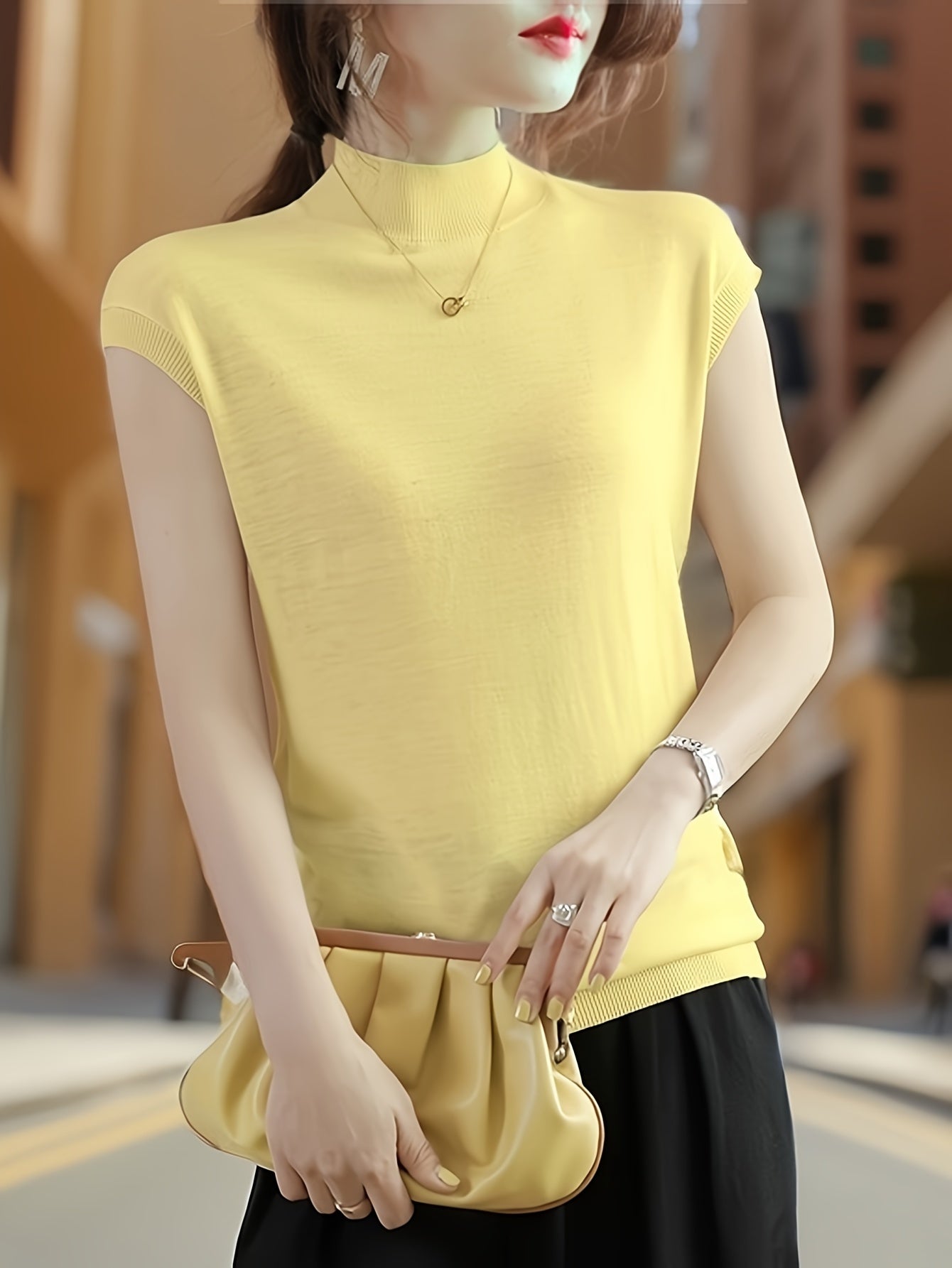 Sleeveless high-neck knit top with a fitted design for women