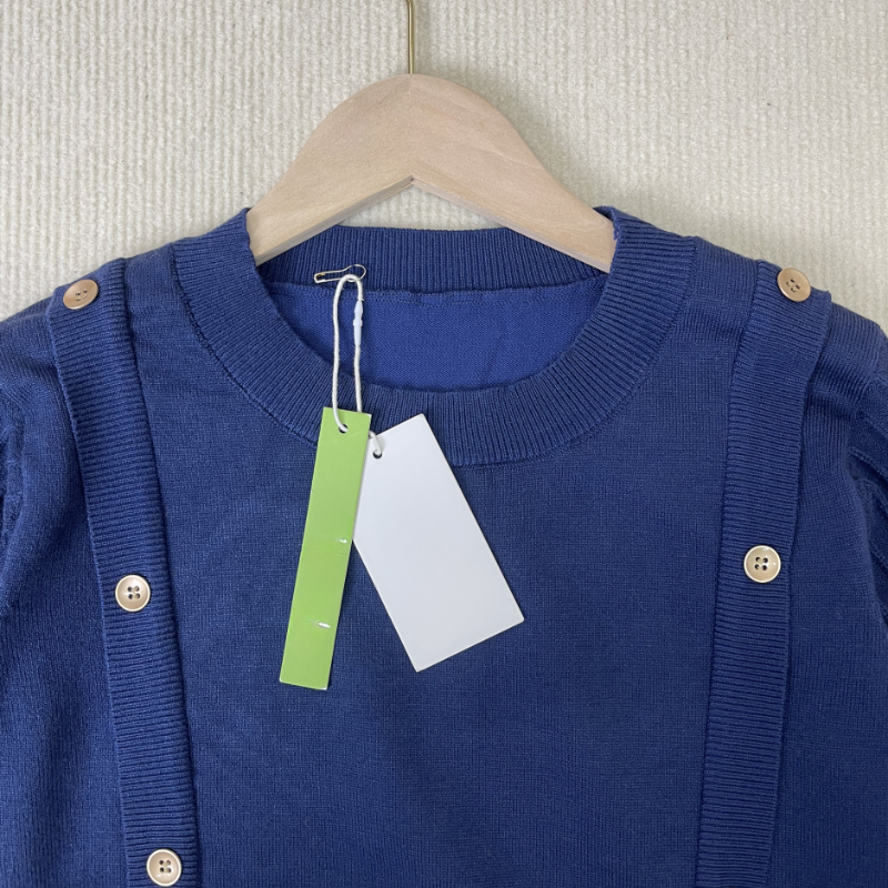 Women's plain round neck sweater with button design