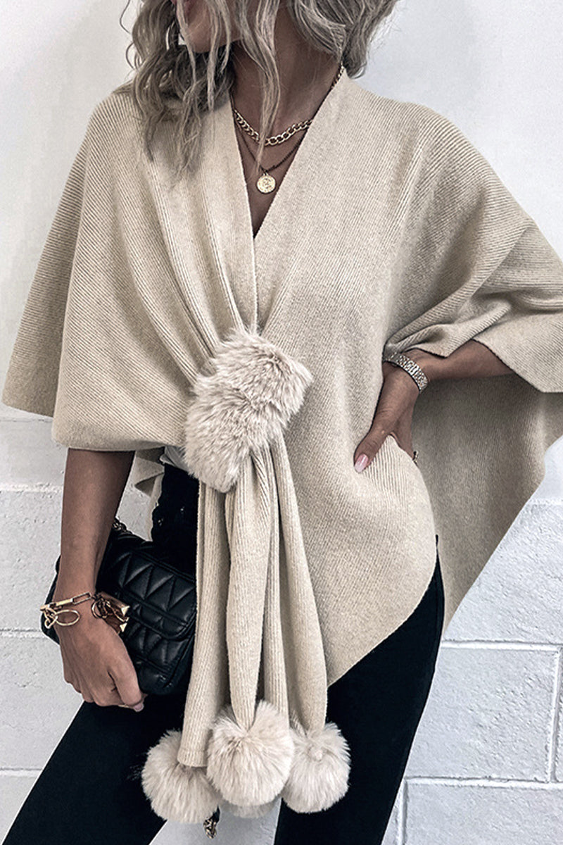Women's knitted shawl with fluffy balls details