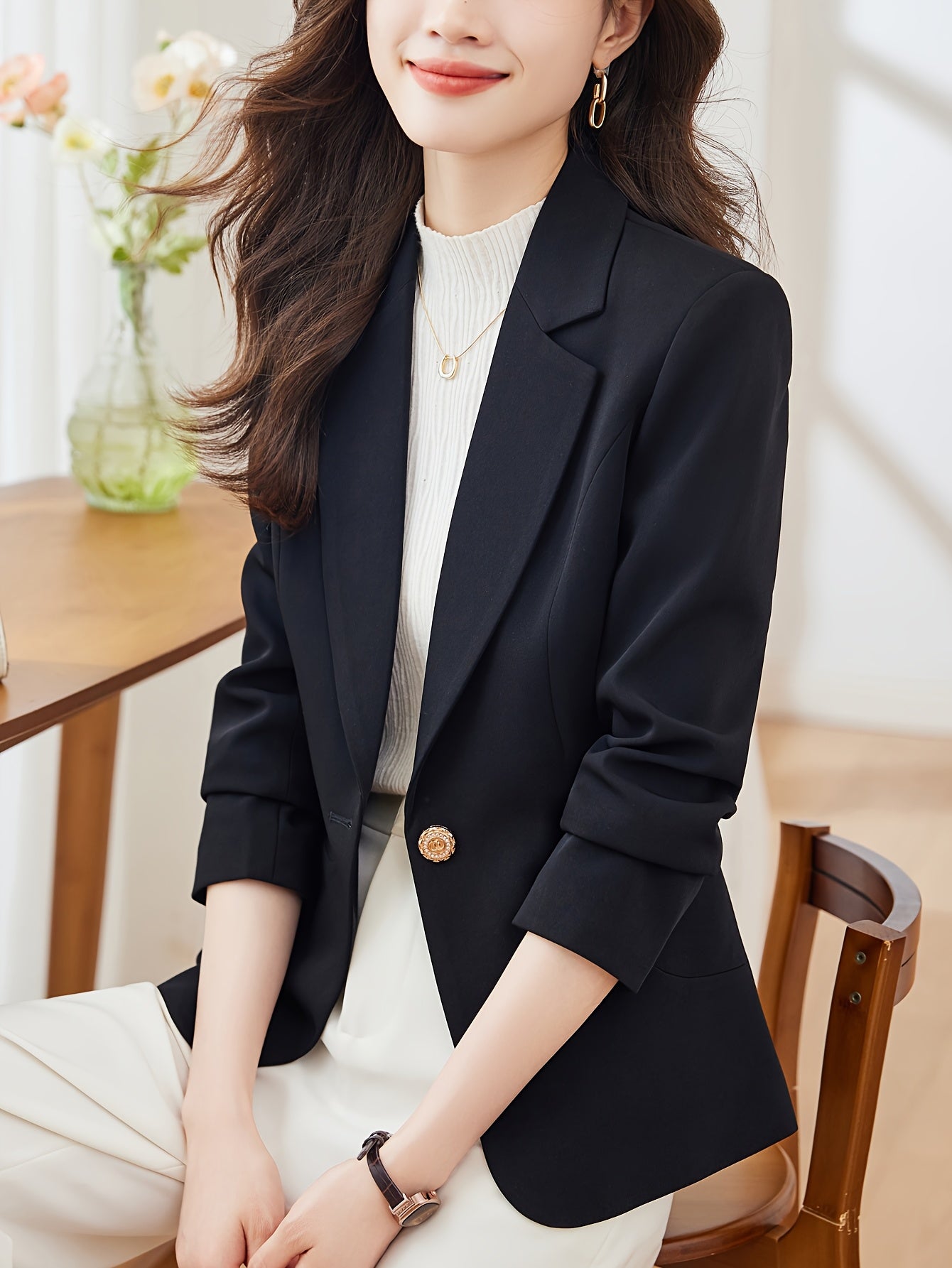 Single-button tailored blazer with notched lapel and long sleeves for women