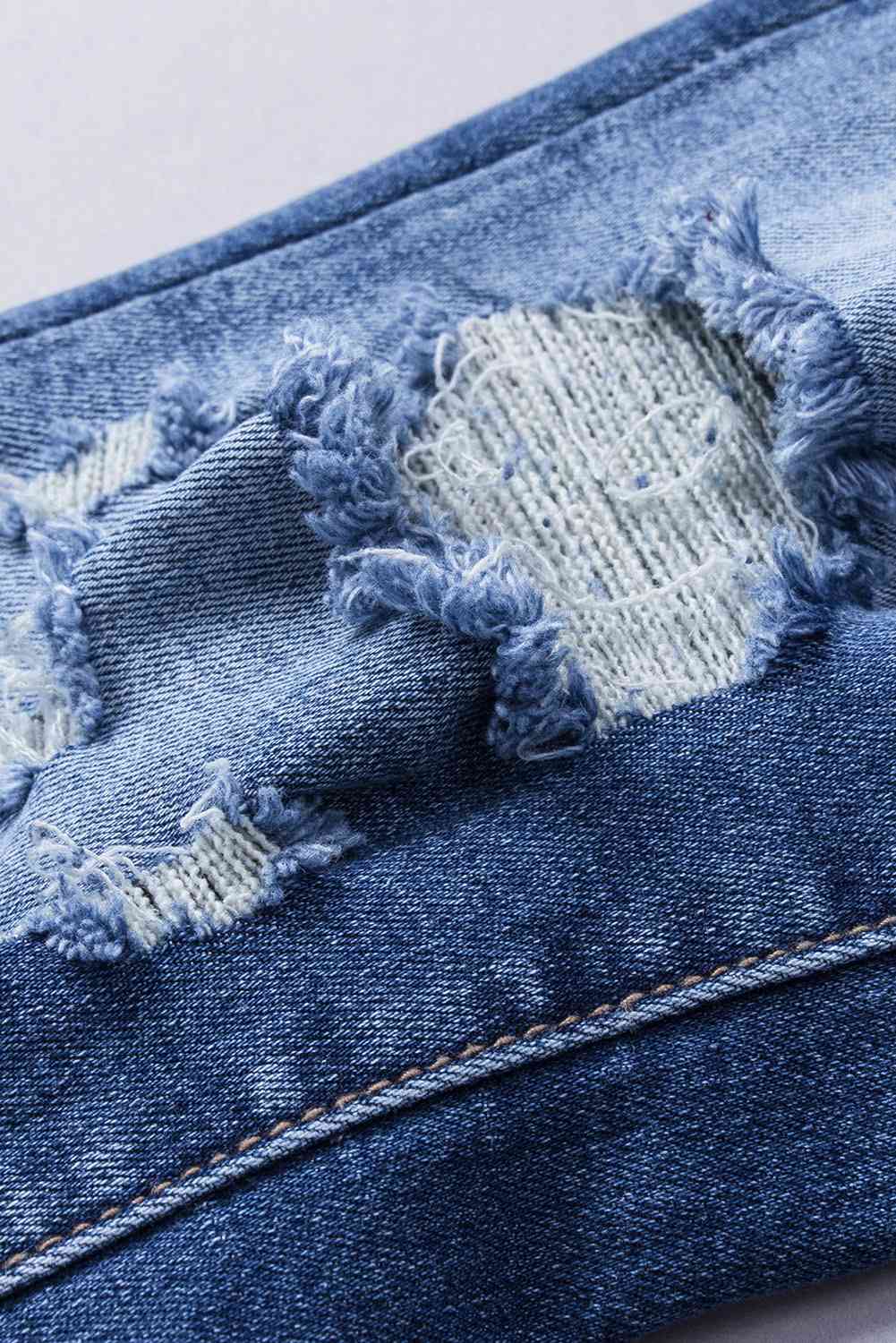 Kamaria - distressed flared jeans with pockets