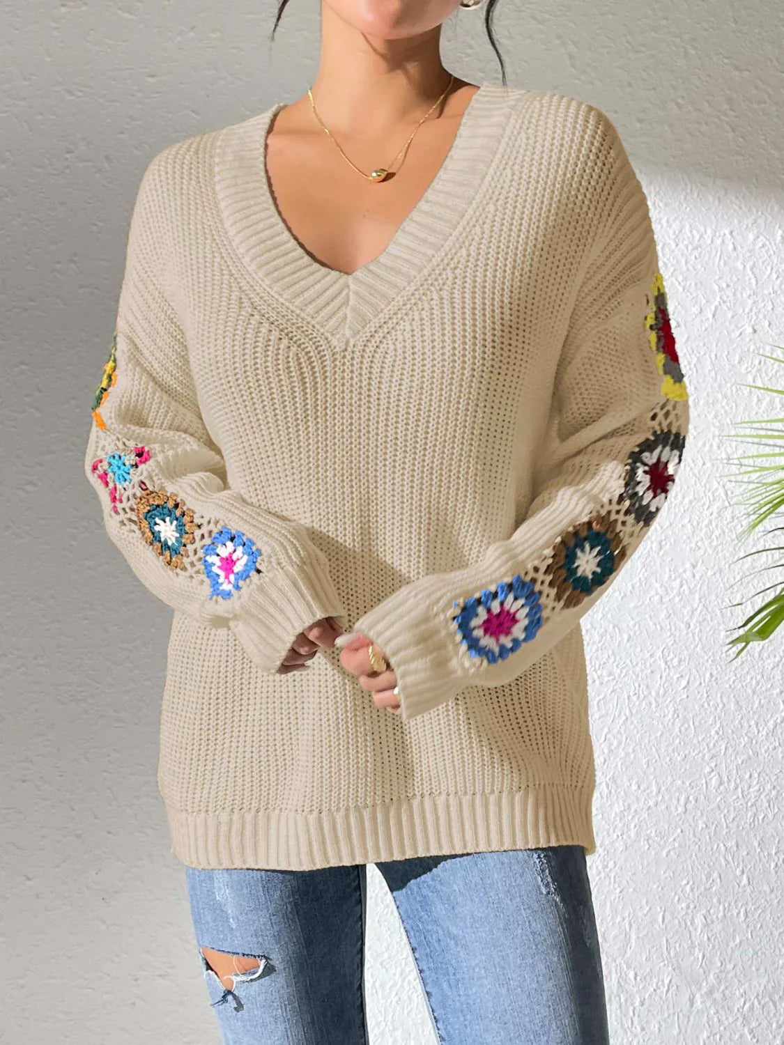 Women's v neck sweater with floral print on each long sleeves