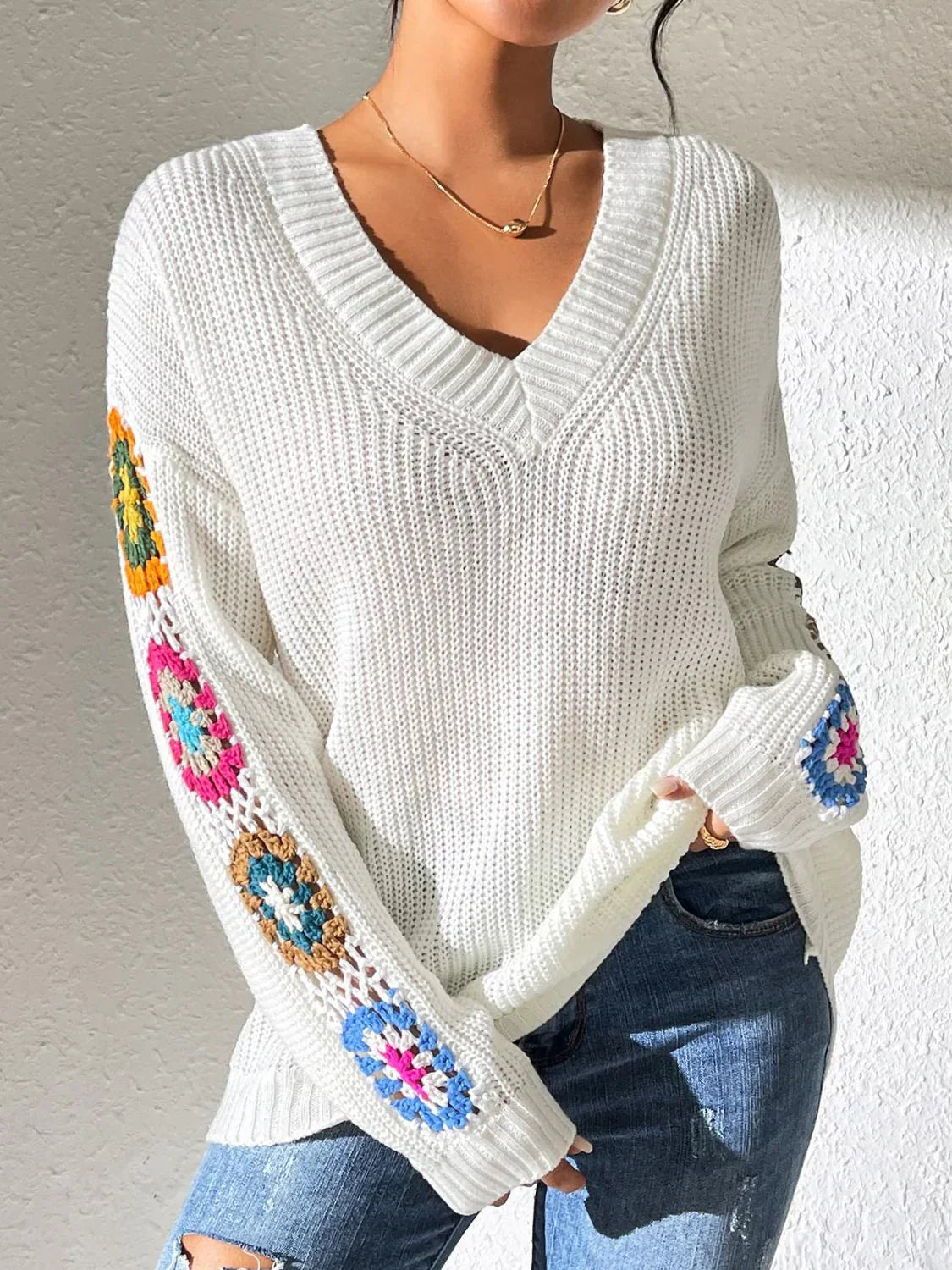 Women's v neck sweater with floral print on each long sleeves