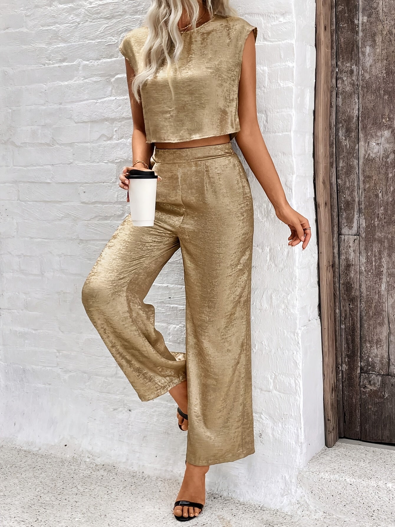 Elegant sleeveless crop top and wide-leg pants set for women