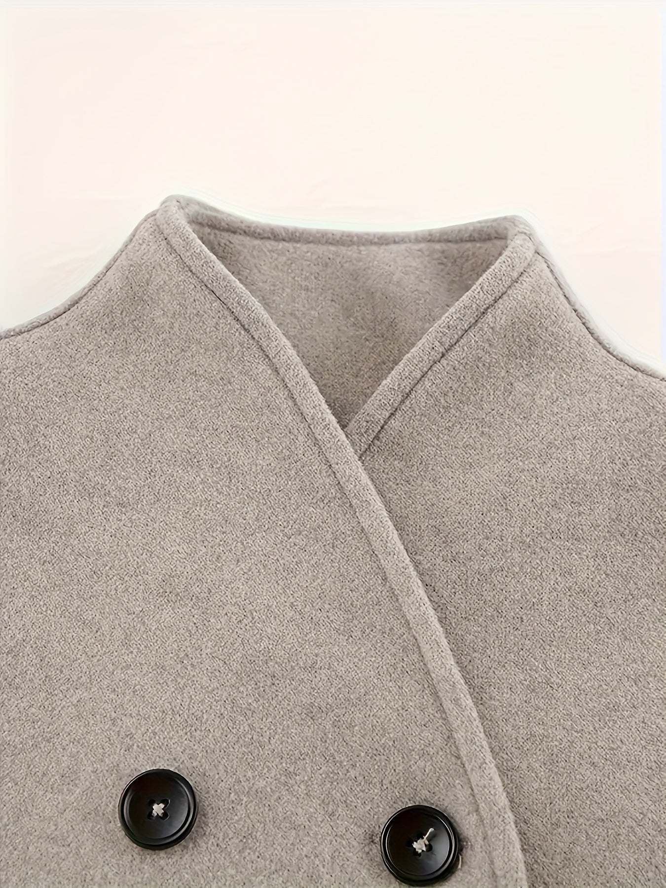 Timeless double-breasted coat with stand collar and elegant design for women