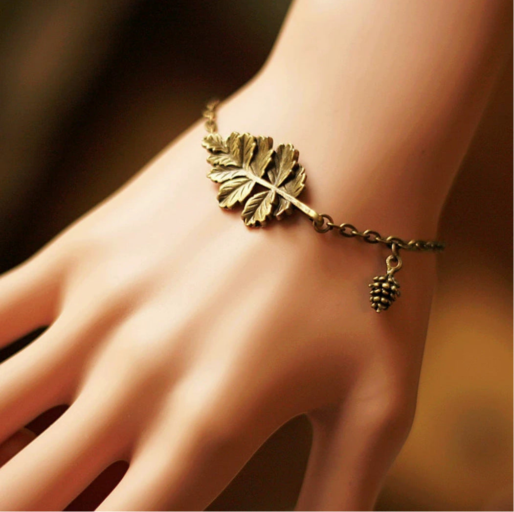 Vintage woodland charm bracelet with squirrel and nature charms