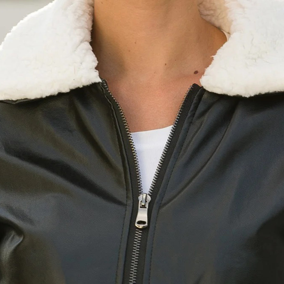 Stylish winter black PU leather jacket for women with wide lapel