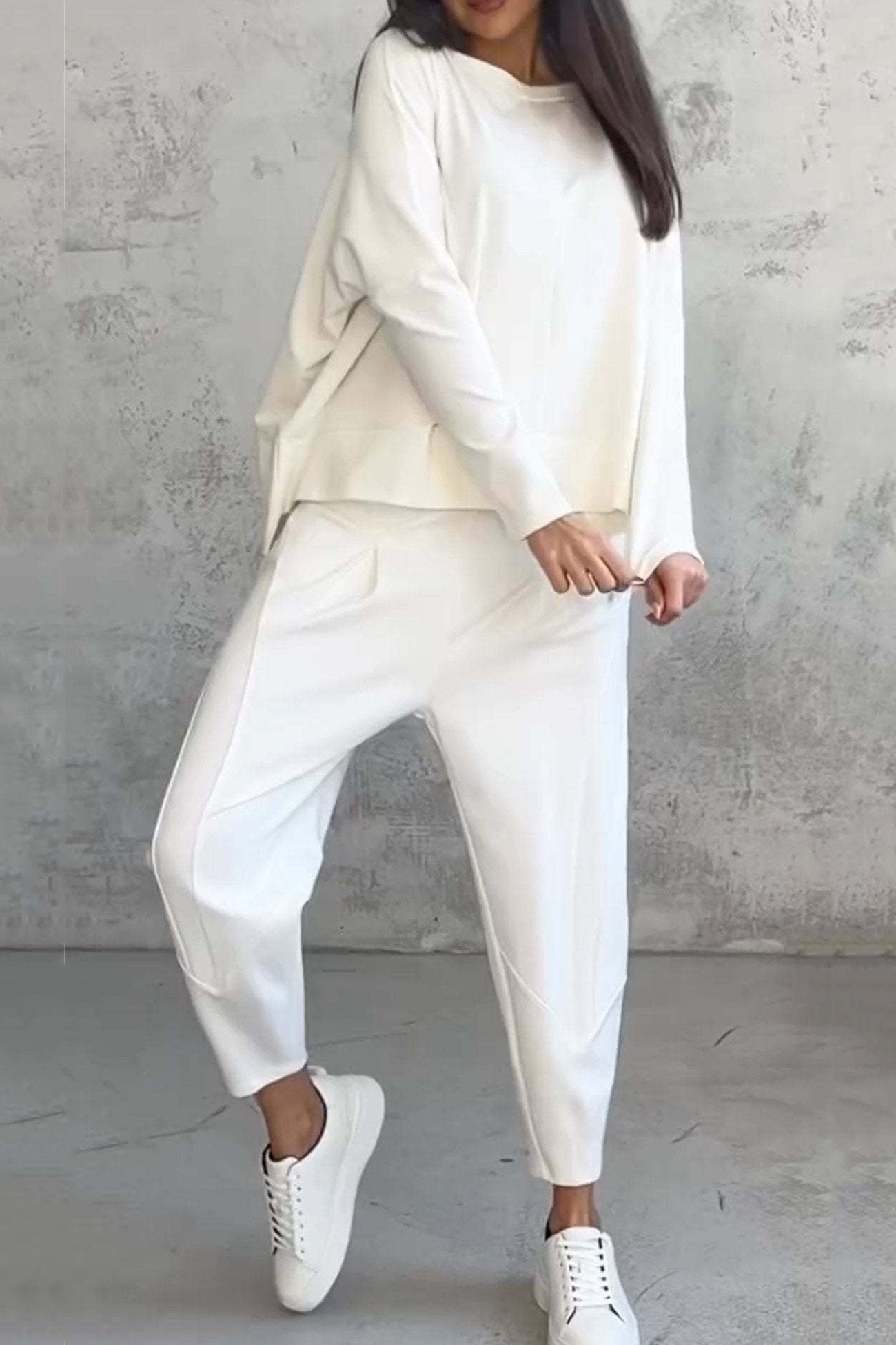Women's high low hem sweatshirt and cropped trouser set