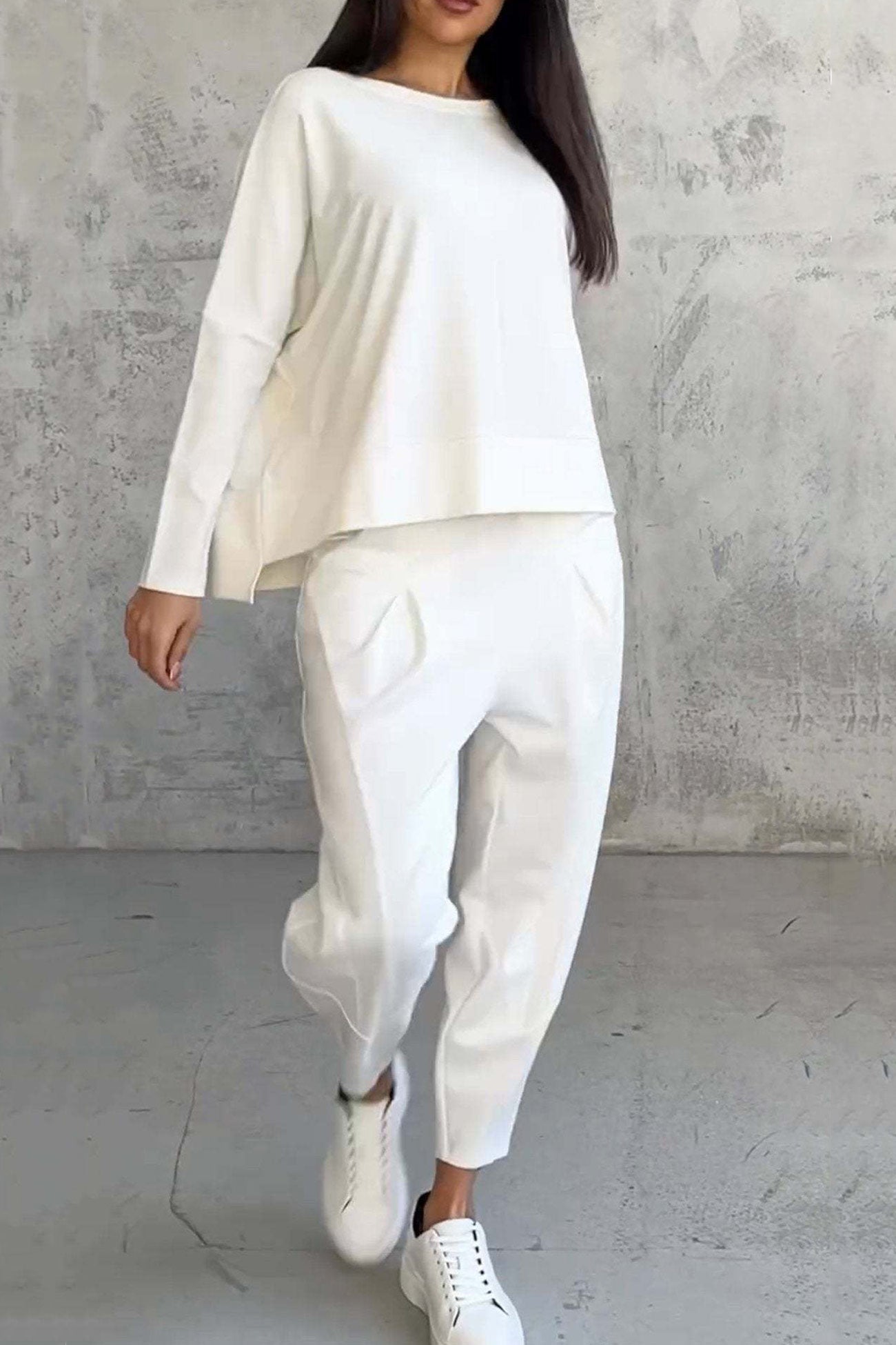Women's high low hem sweatshirt and cropped trouser set