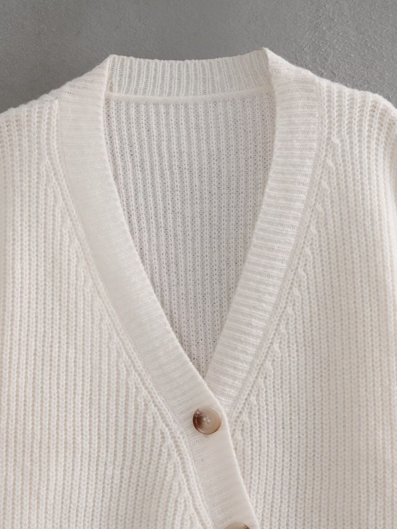 Women's v-neck loose slant button knitted jacket