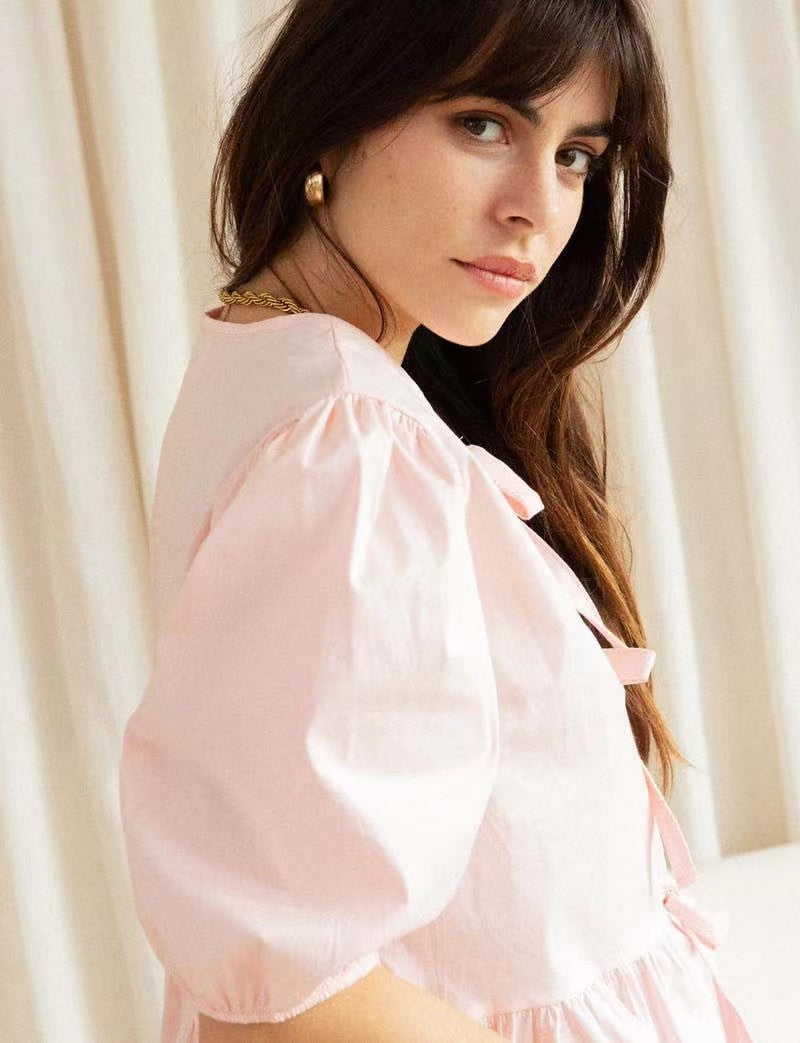 Women's puff-sleeve peplum bow top
