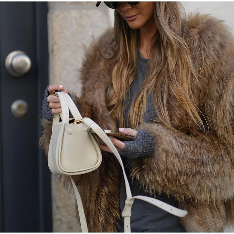 Women's plush faux fur coat perfect for winter, cozy and stylish outerwear