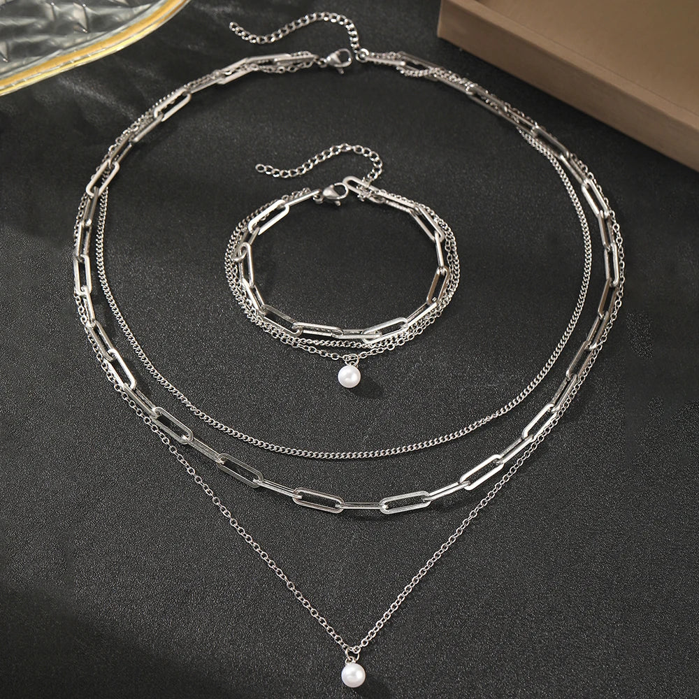 Layered chain necklace and bracelet set with pearl accent