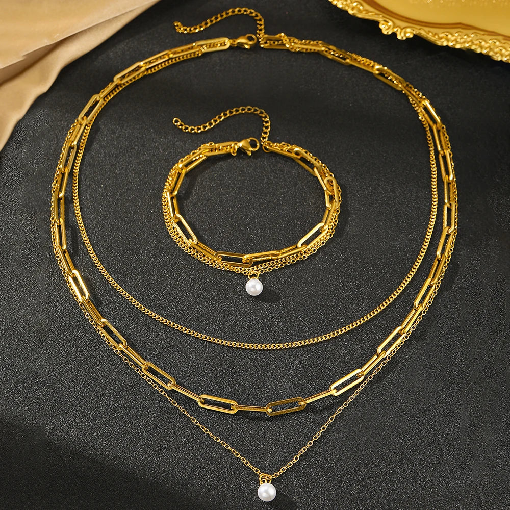 Layered chain necklace and bracelet set with pearl accent