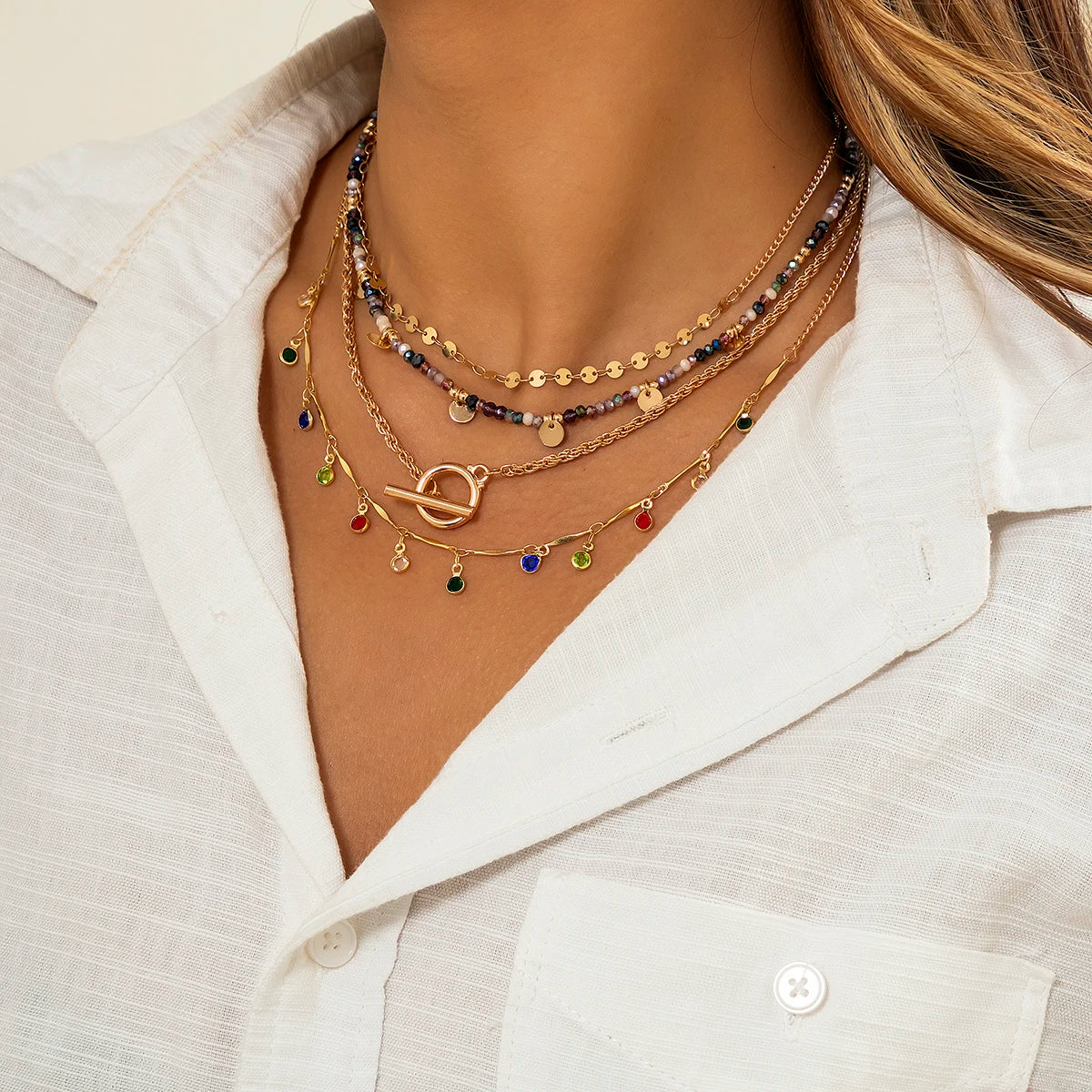 Multi-layered beaded and charm necklace set