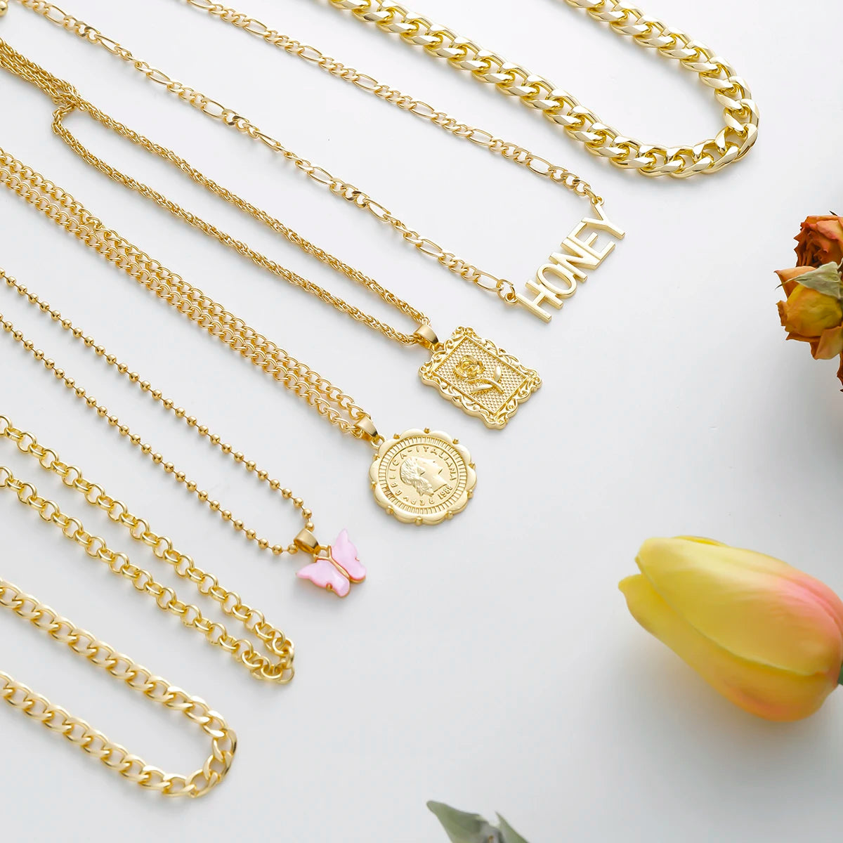 Gold layered chain necklace set with "Honey" pendant
