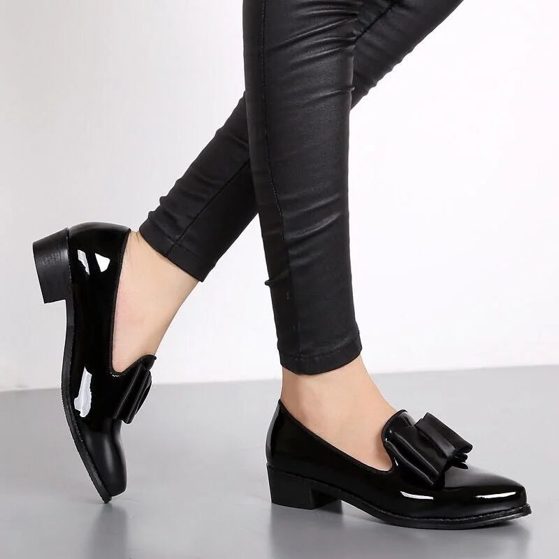 Women's elegant glossy slip-on flats with bow accent