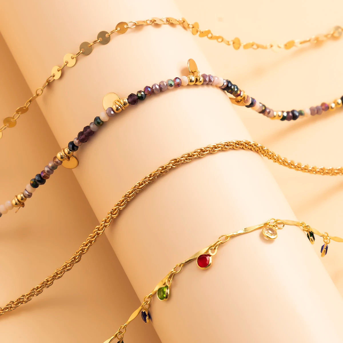 Multi-layered beaded and charm necklace set