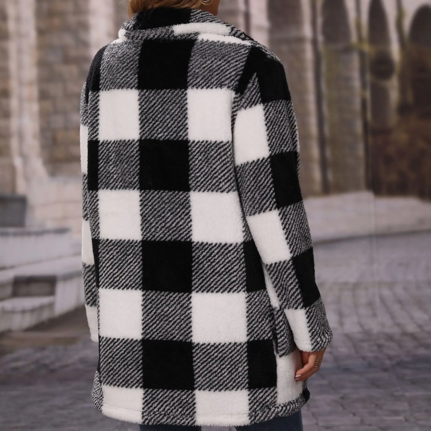 Women's black and white checkered long coat with lapel and zipper
