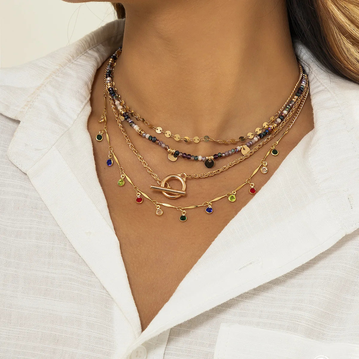 Multi-layered beaded and charm necklace set