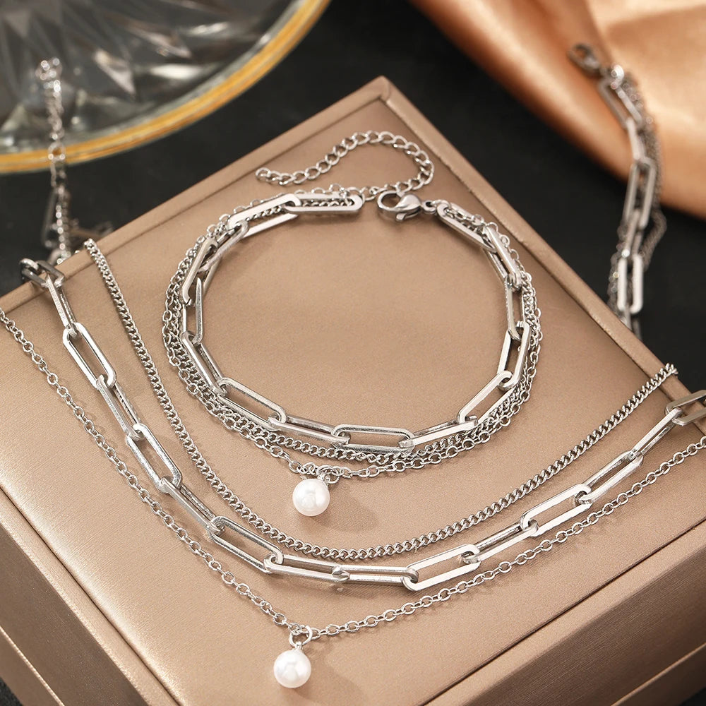 Layered chain necklace and bracelet set with pearl accent