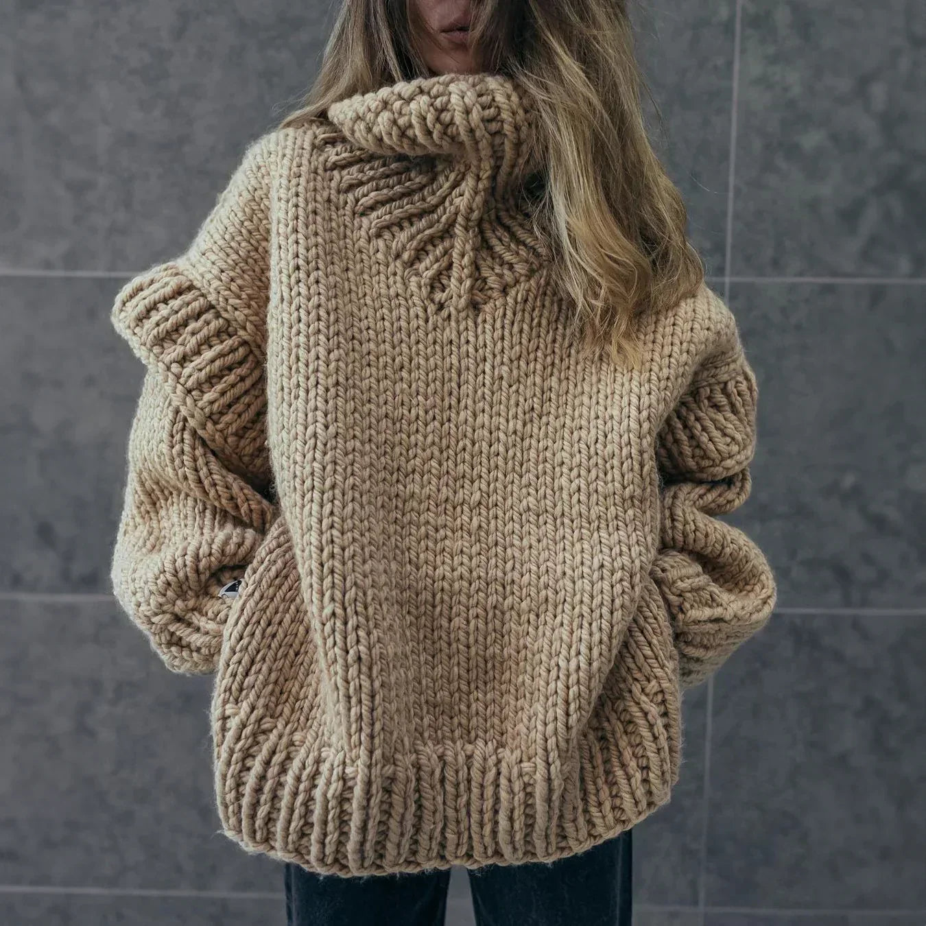 Women's chunky knit turtleneck sweater with stylish sleeves