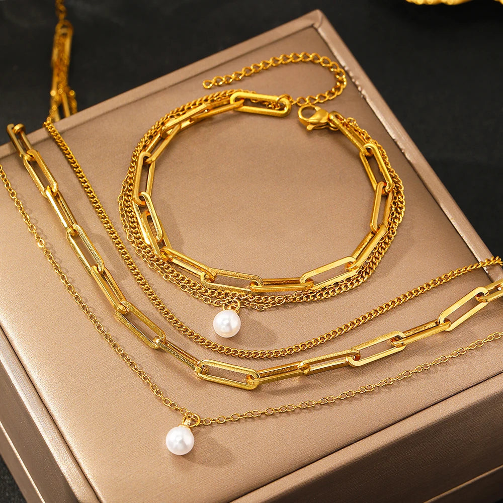 Layered chain necklace and bracelet set with pearl accent