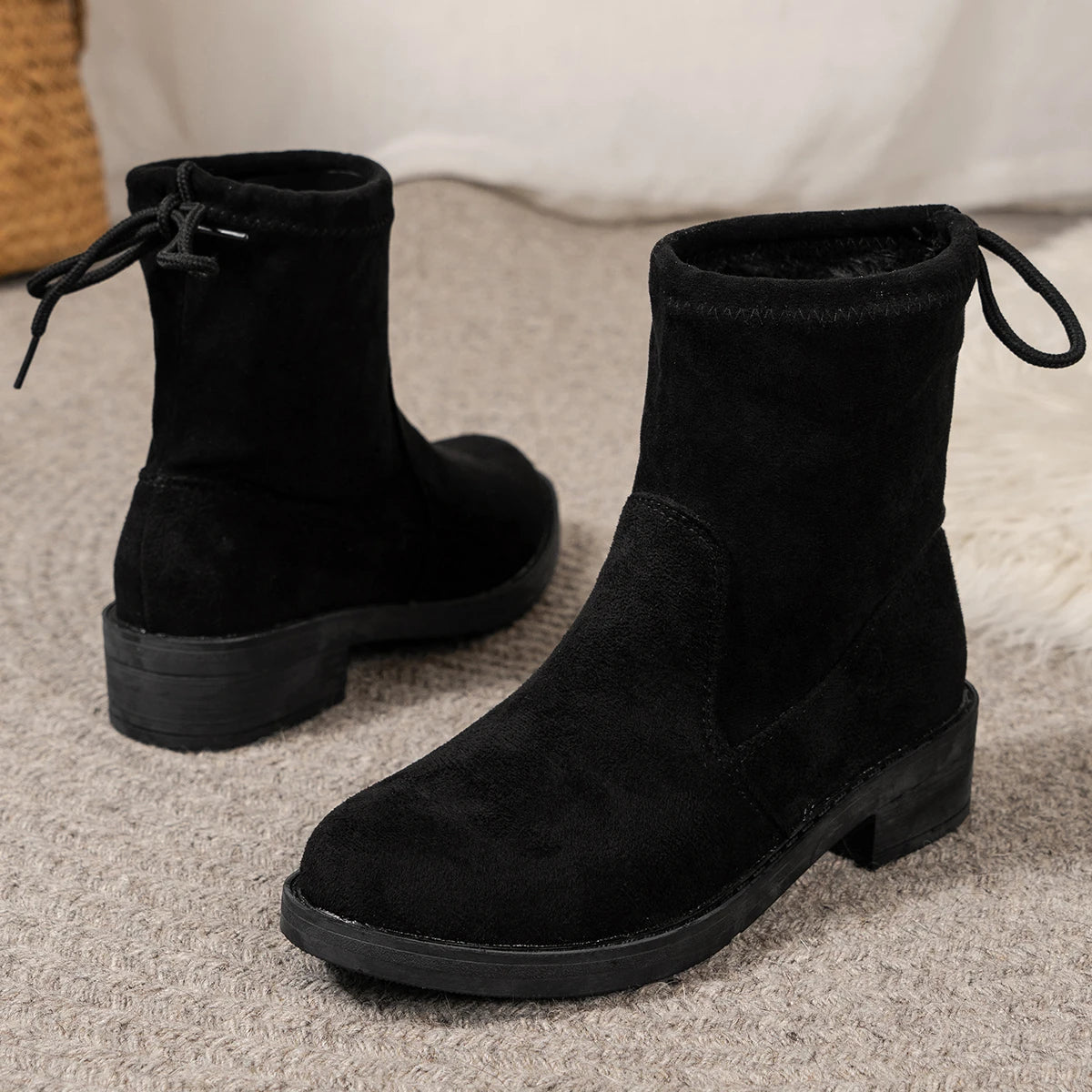 Women's low heel ankle boots with drawstring closure