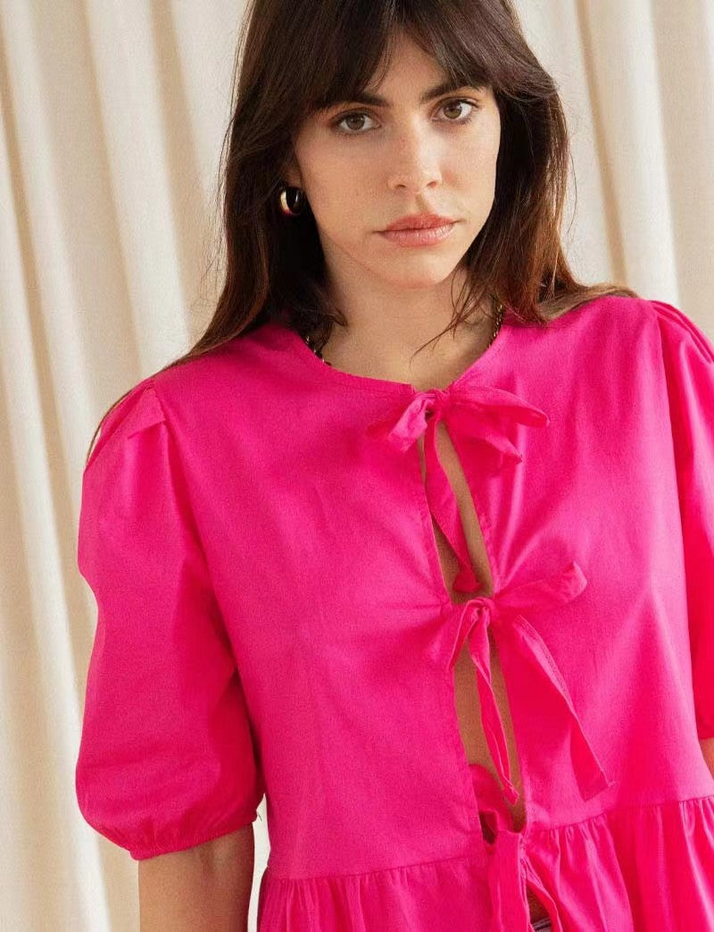 Women's puff-sleeve peplum bow top