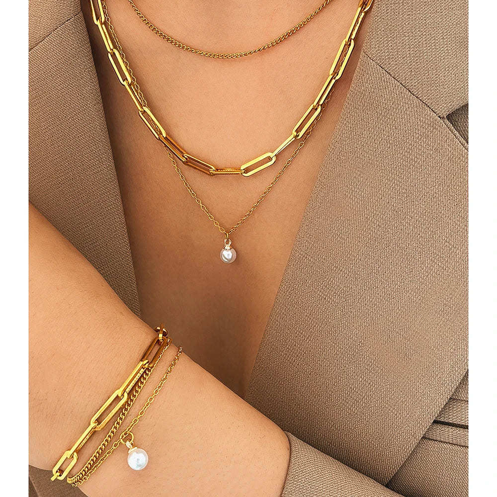 Layered chain necklace and bracelet set with pearl accent