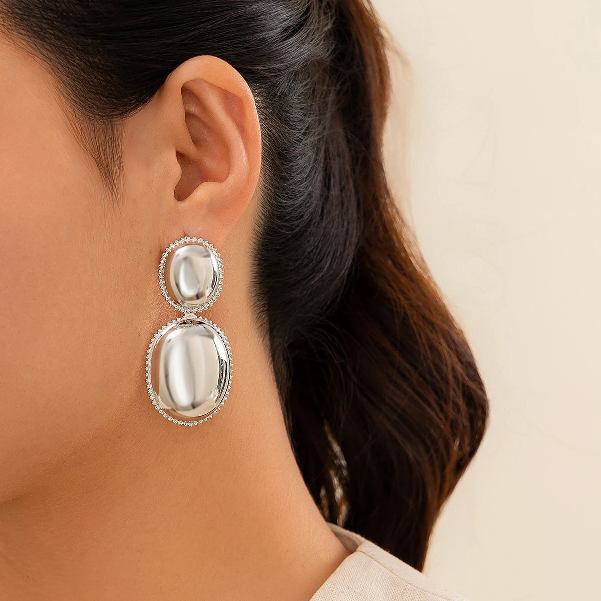 Trendy gothic ball drop earrings with piercing detail