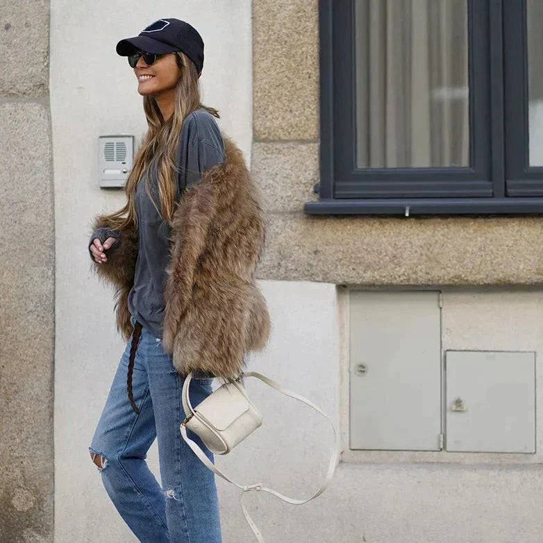 Women's plush faux fur coat perfect for winter, cozy and stylish outerwear