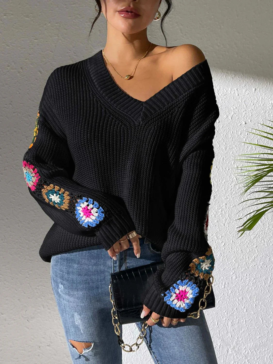 Women's v neck sweater with floral print on each long sleeves