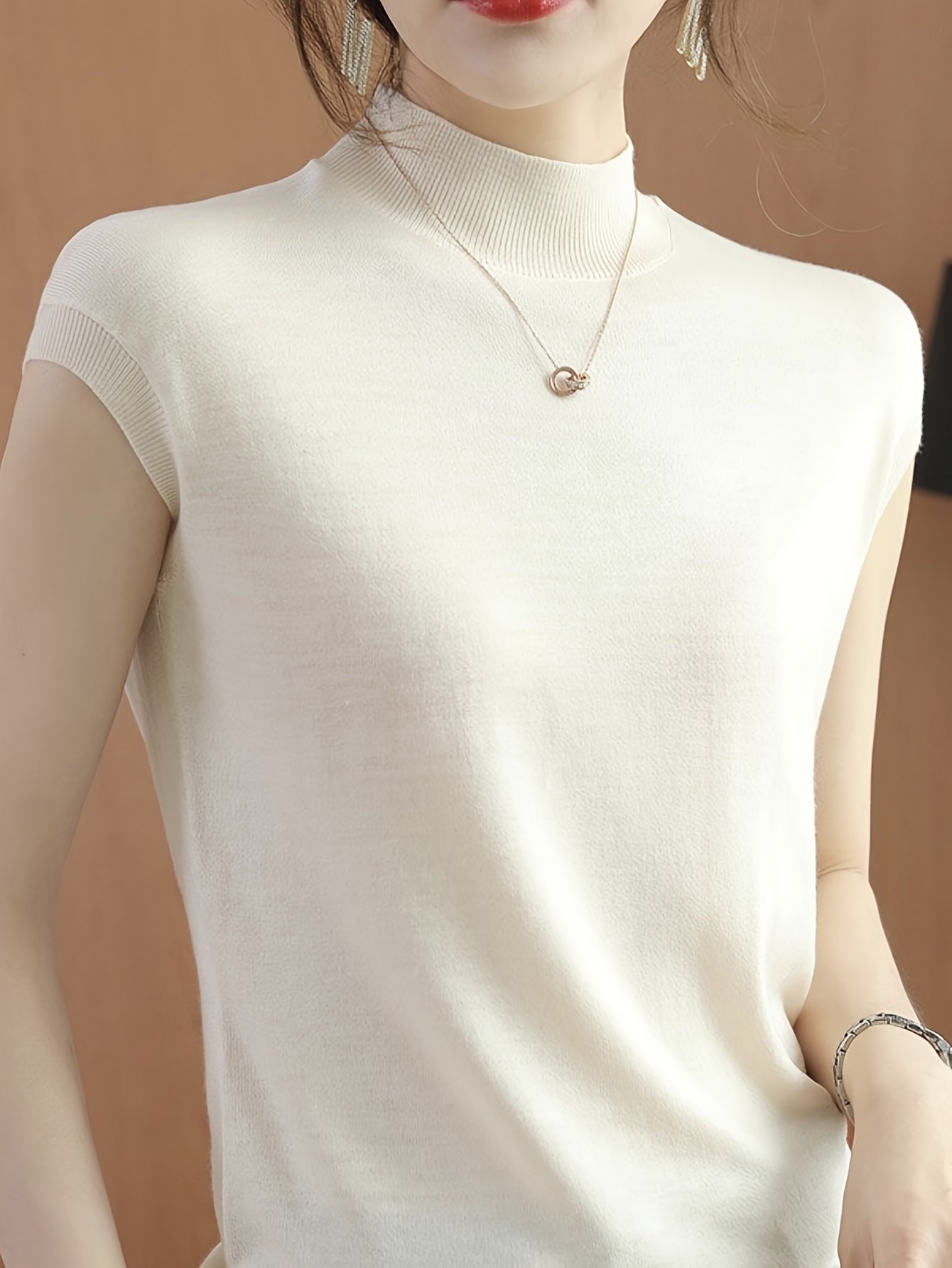 Sleeveless high-neck knit top with a fitted design for women