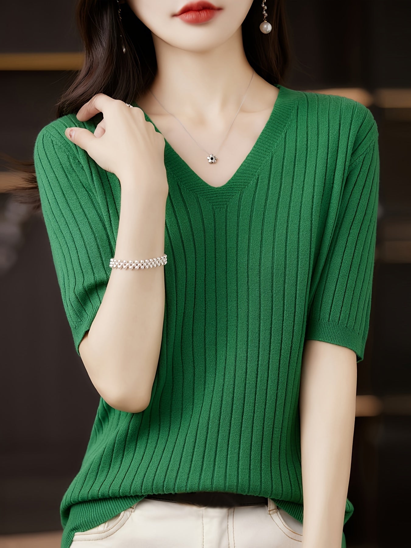 Stylish ribbed knit v-neck top with short sleeves and flattering fit for women
