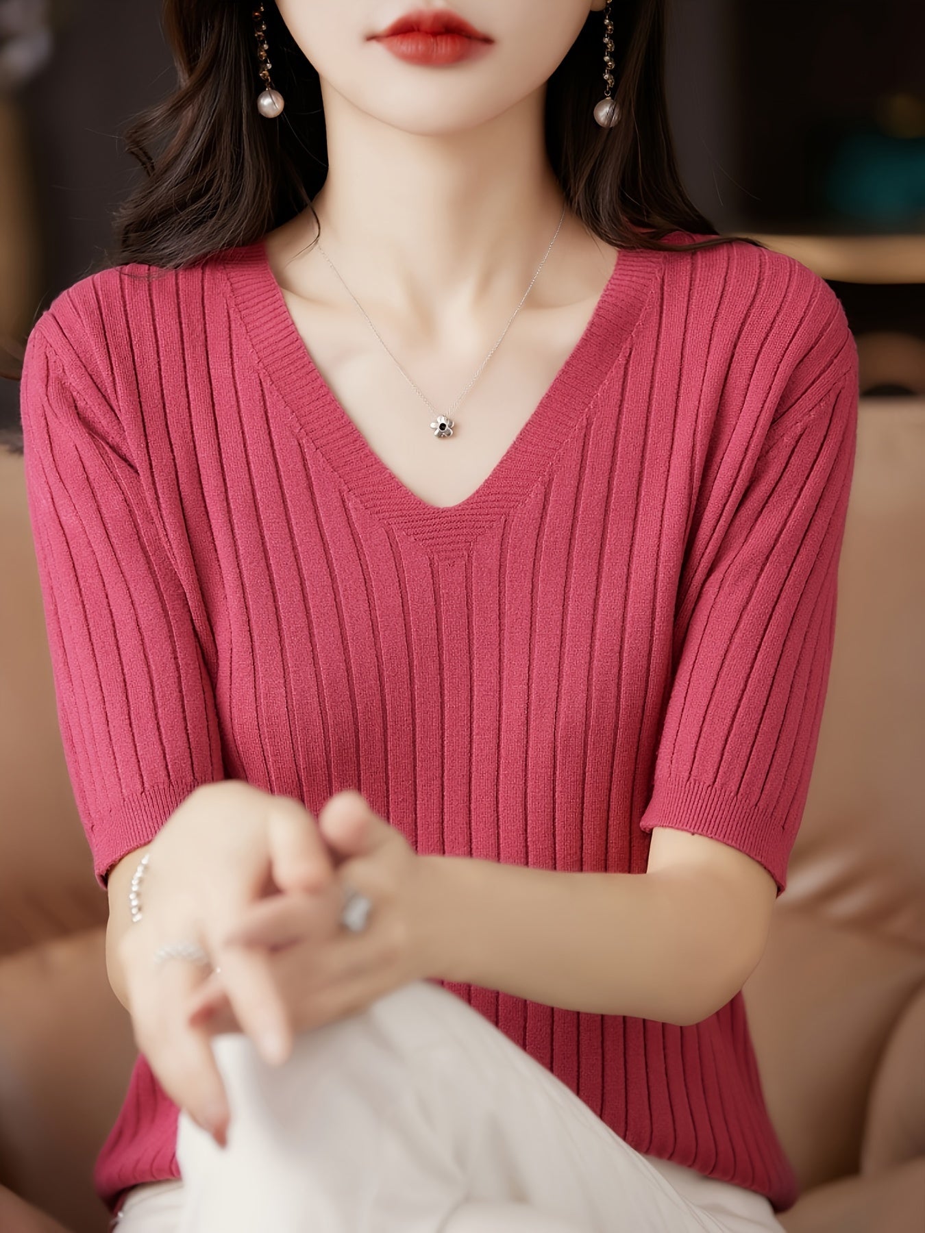 Stylish ribbed knit v-neck top with short sleeves and flattering fit for women