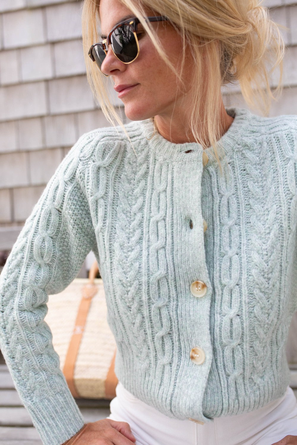 Fresh blue knitted sweater with crew neckline with button closure