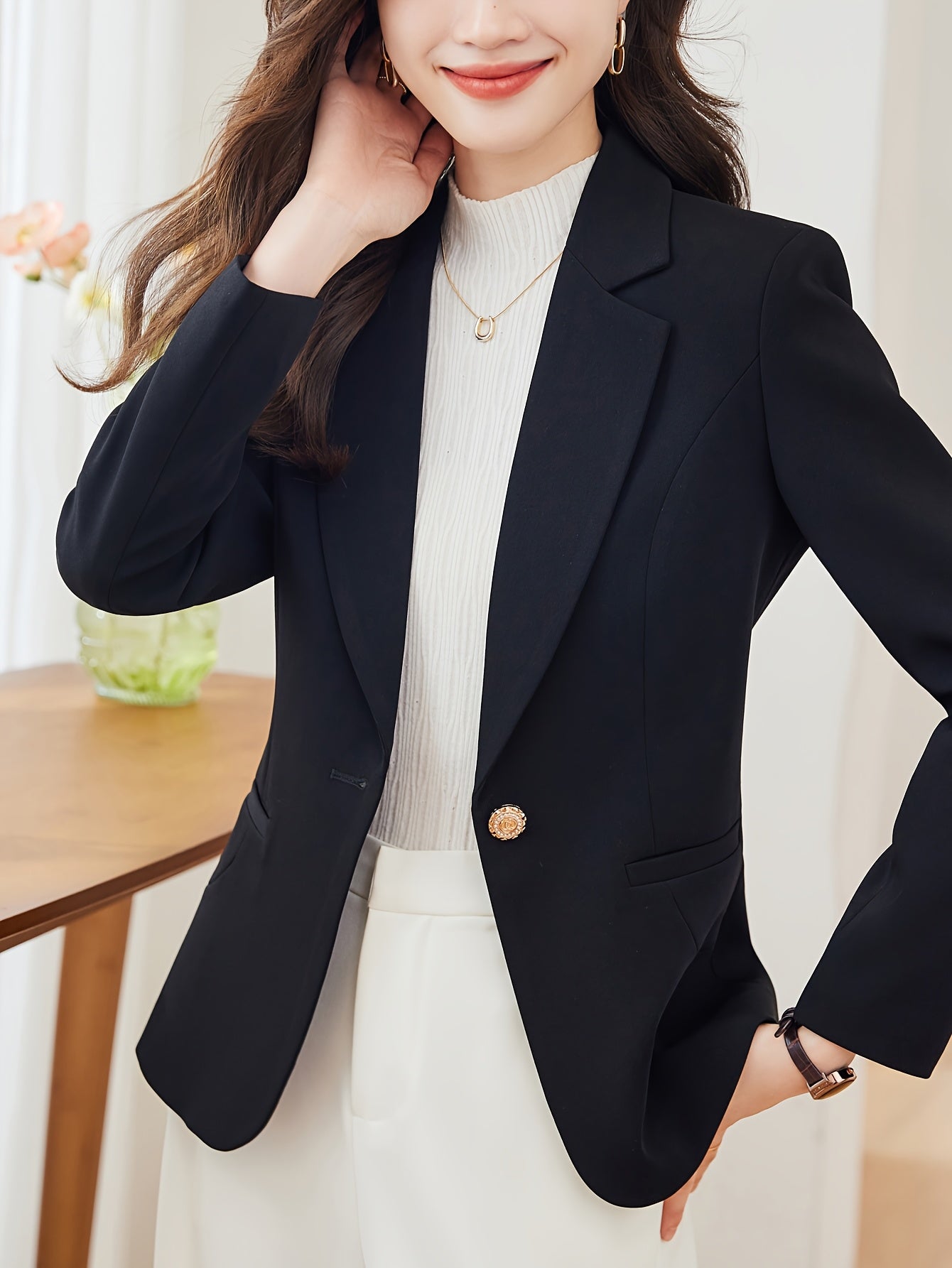 Single-button tailored blazer with notched lapel and long sleeves for women