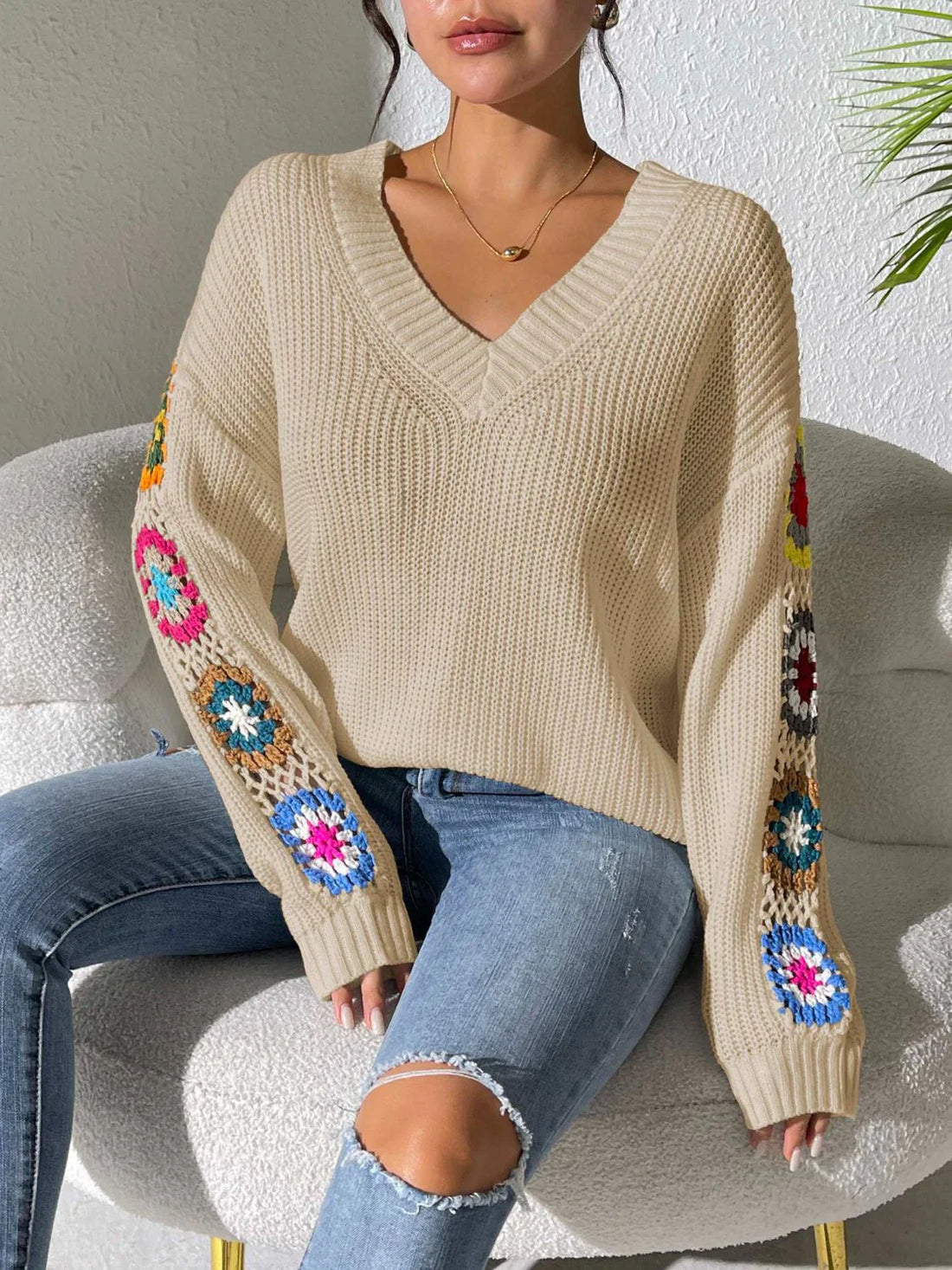 Women's v neck sweater with floral print on each long sleeves