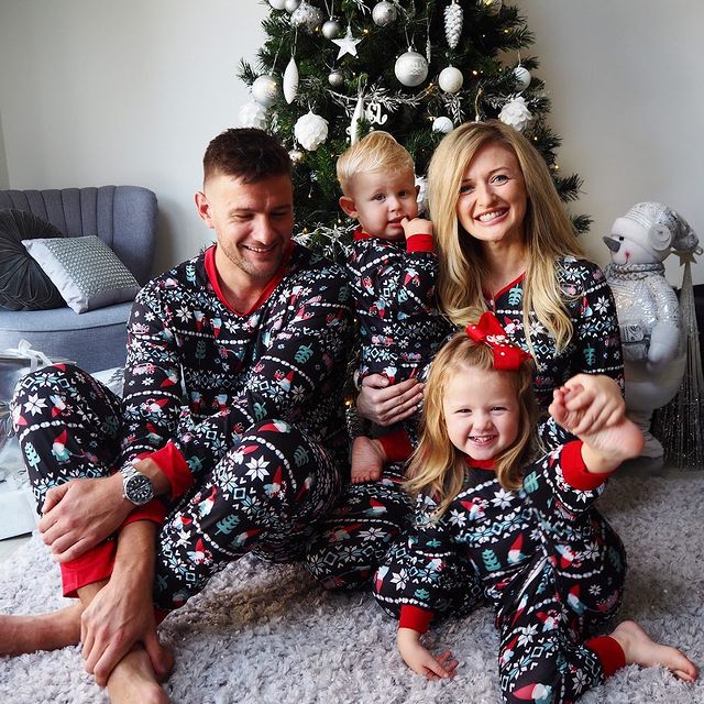 Festive family matching pajamas set with holiday patterns