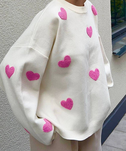 Women's solid color round neck knitted sweater with heart print