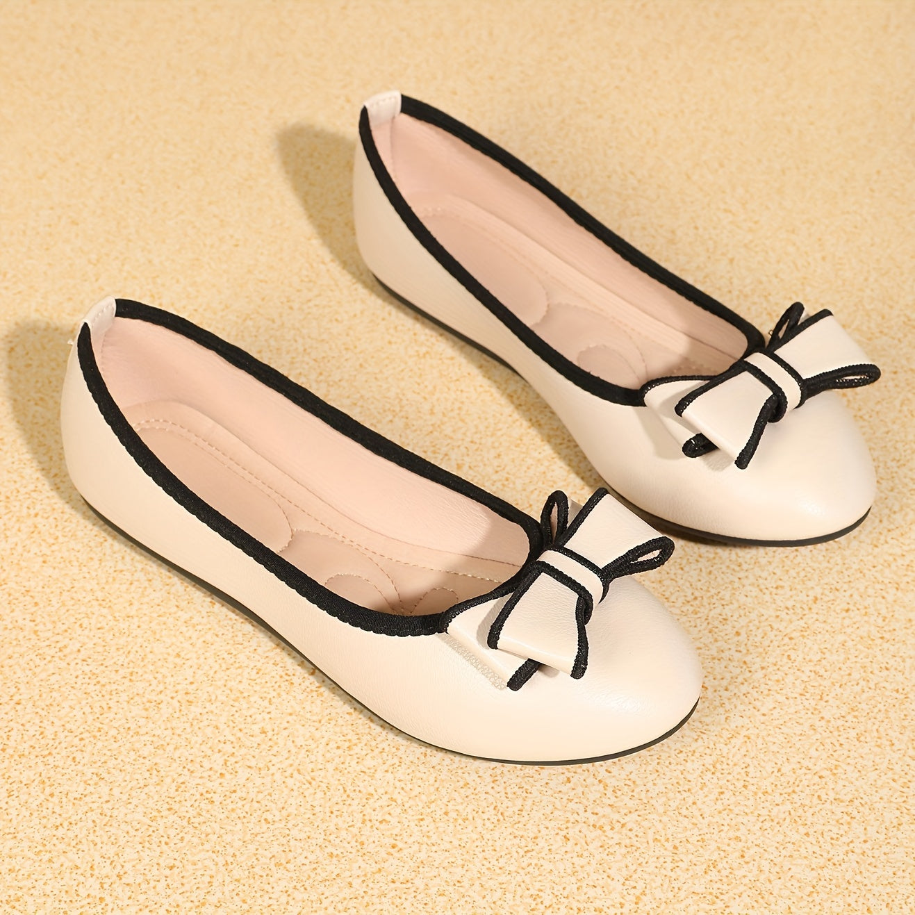 Elegant round-toe ballet flats with bowknot detail and sleek edging for women