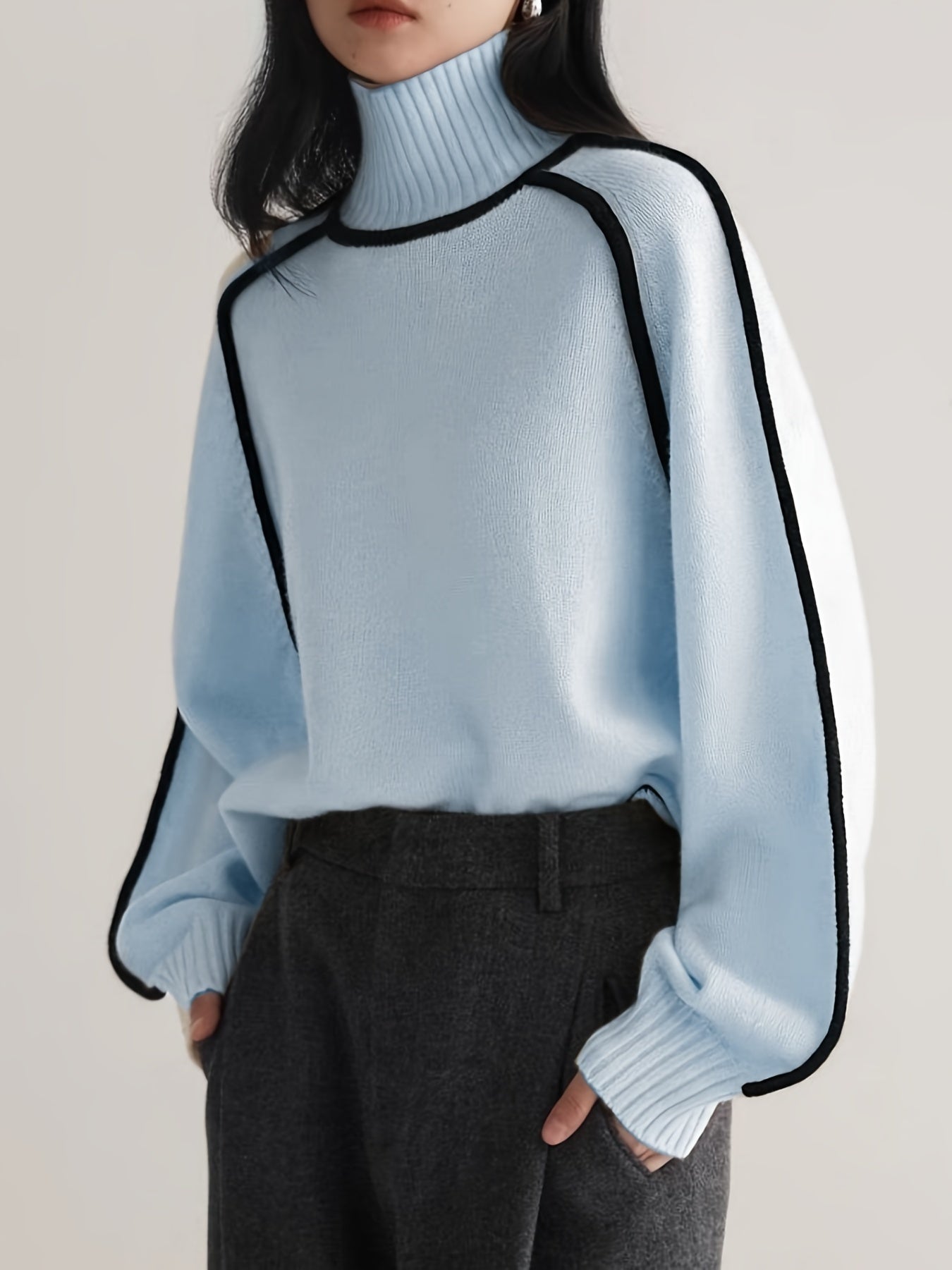 High-neck knit sweater with outlined design and long sleeves for women