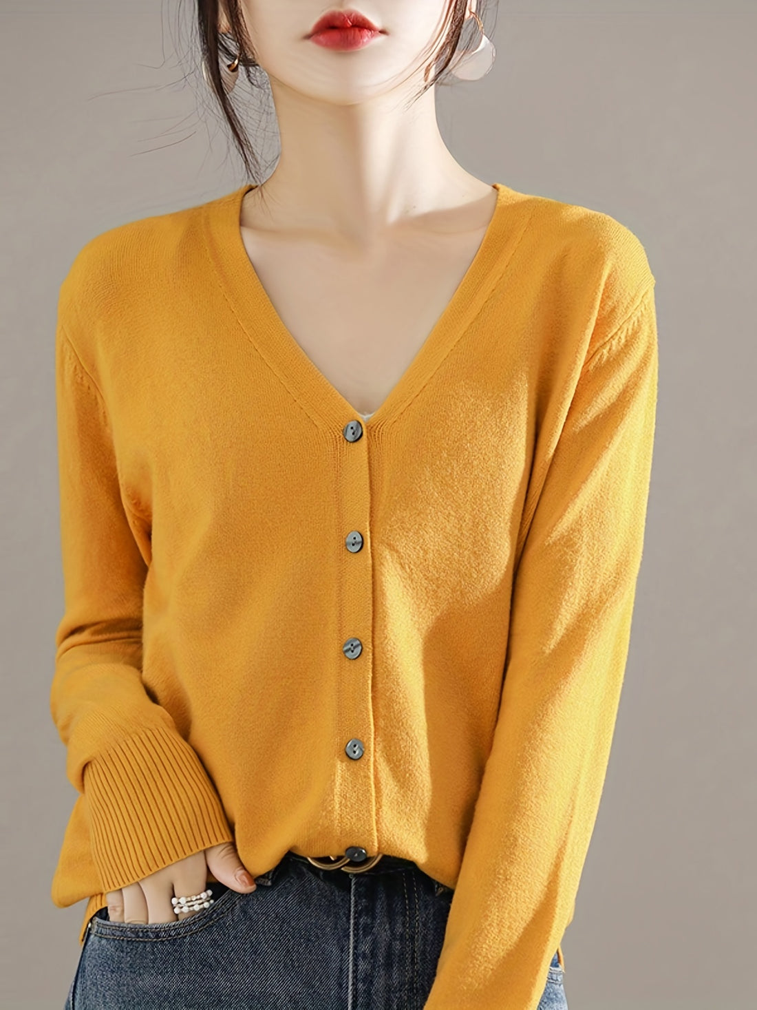 Lightweight button-front cardigan with v-neck and ribbed hem for women