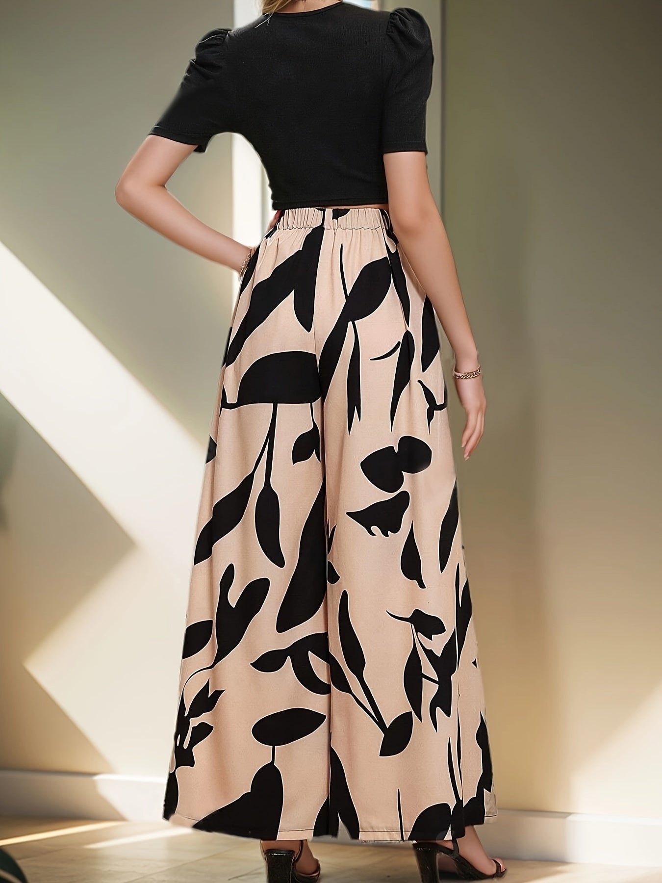 Elegant two-piece pantsuit set with floral wide-leg pants for women