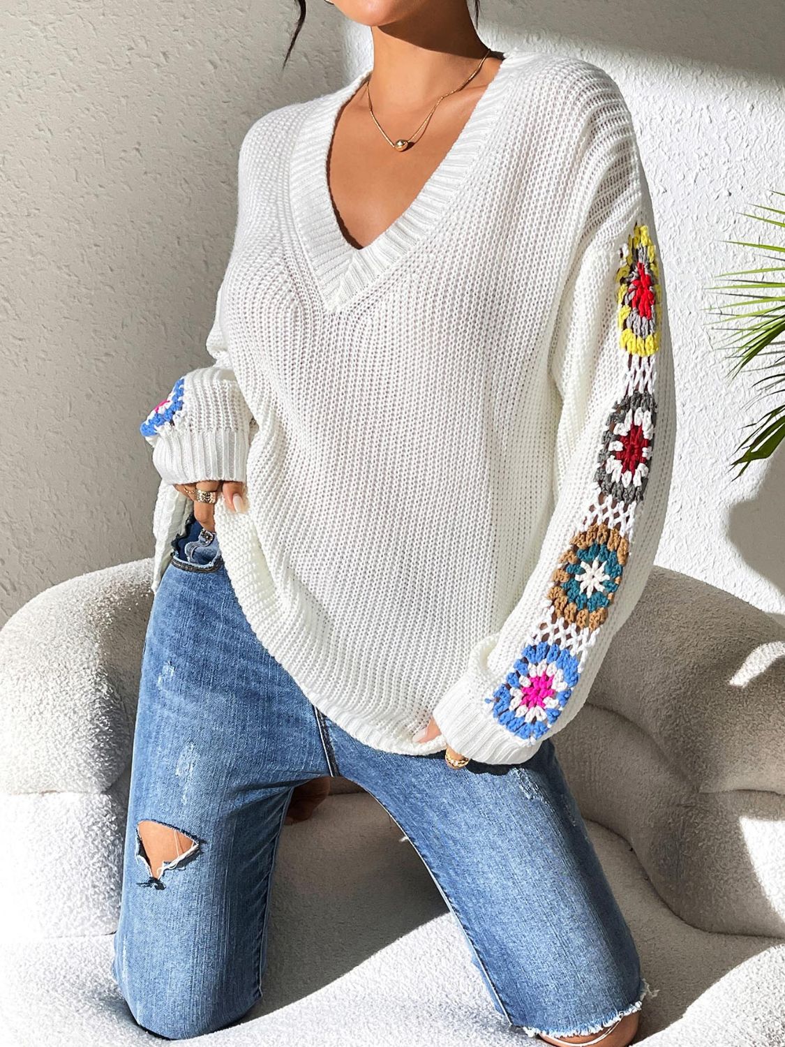 Women's v neck sweater with floral print on each long sleeves