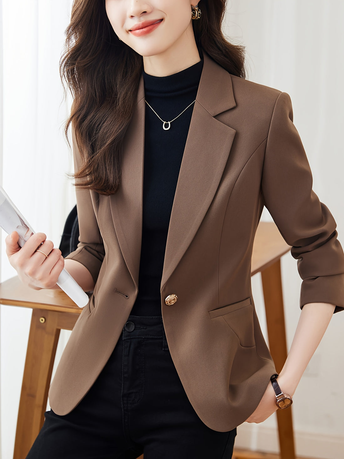 Single-button tailored blazer with notched lapel and long sleeves for women