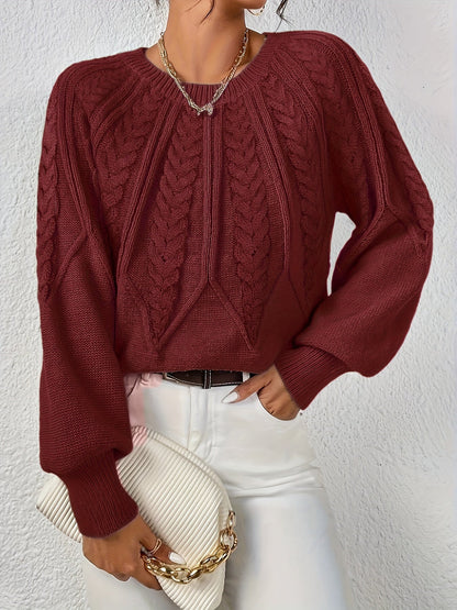 Women's round neck knitted pullover with cable pattern