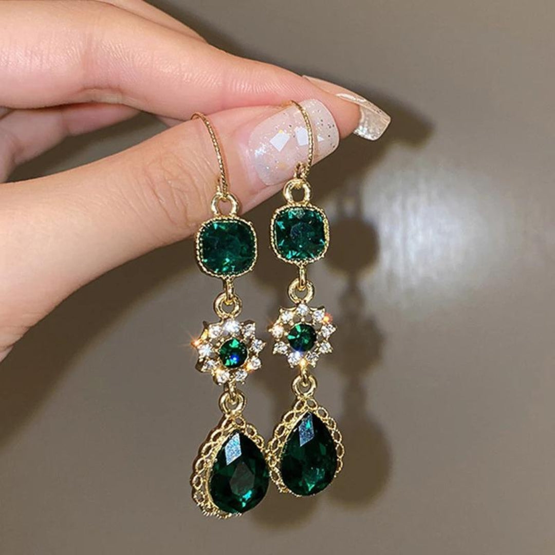 Dangling earrings with green zirconia