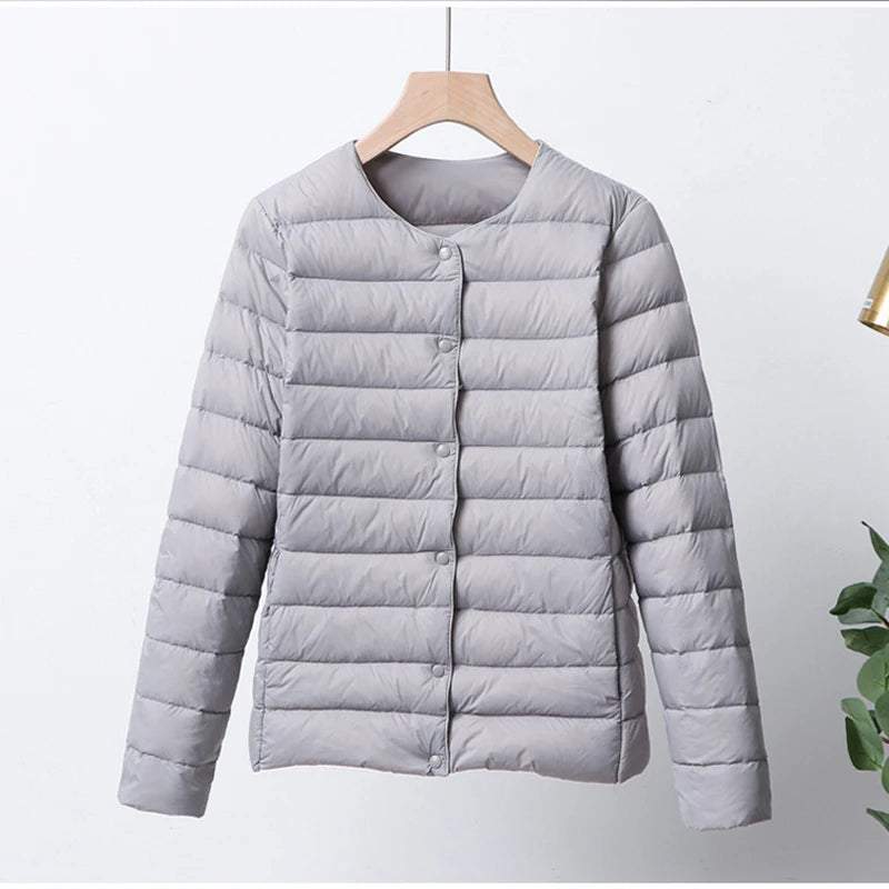 Misha - packable puffer jacket with snap closure
